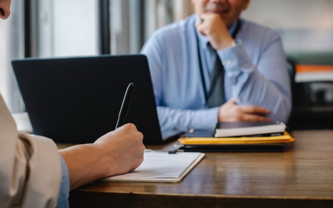 Two people at a table having a meeting